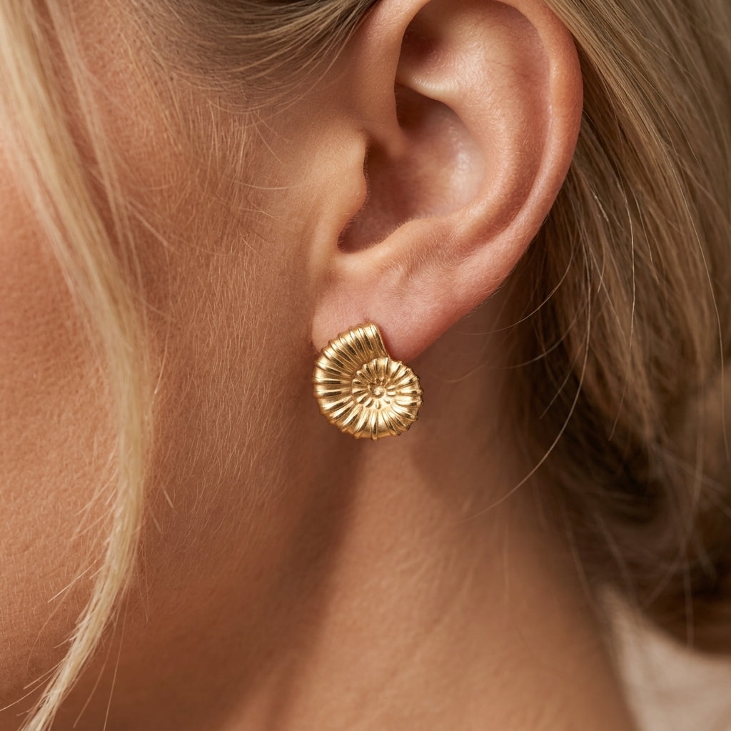beach earrings gold shell-inspired stud earrings with a textured spiral design and coastal aesthetic perfect for vacation and summer styling