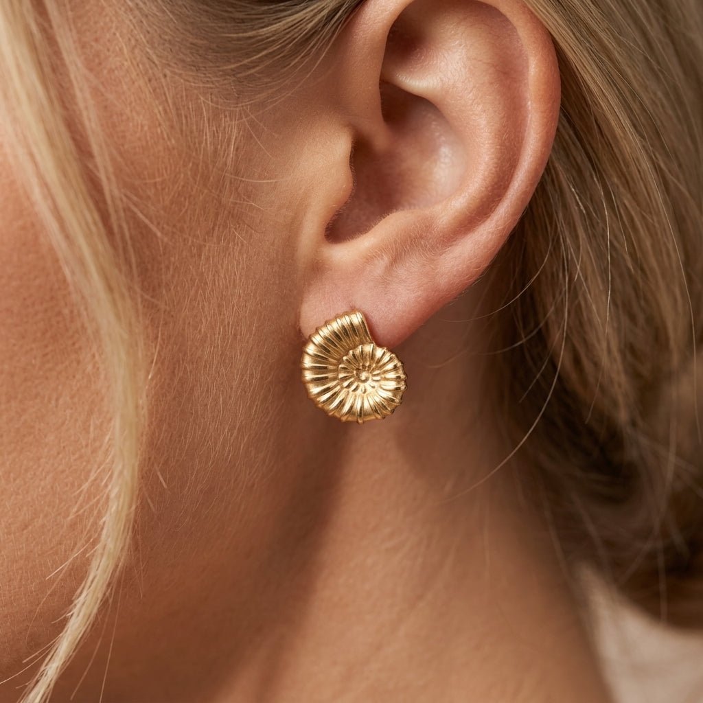 beach earrings gold shell-inspired stud earrings with a textured spiral design and coastal aesthetic perfect for vacation and summer styling