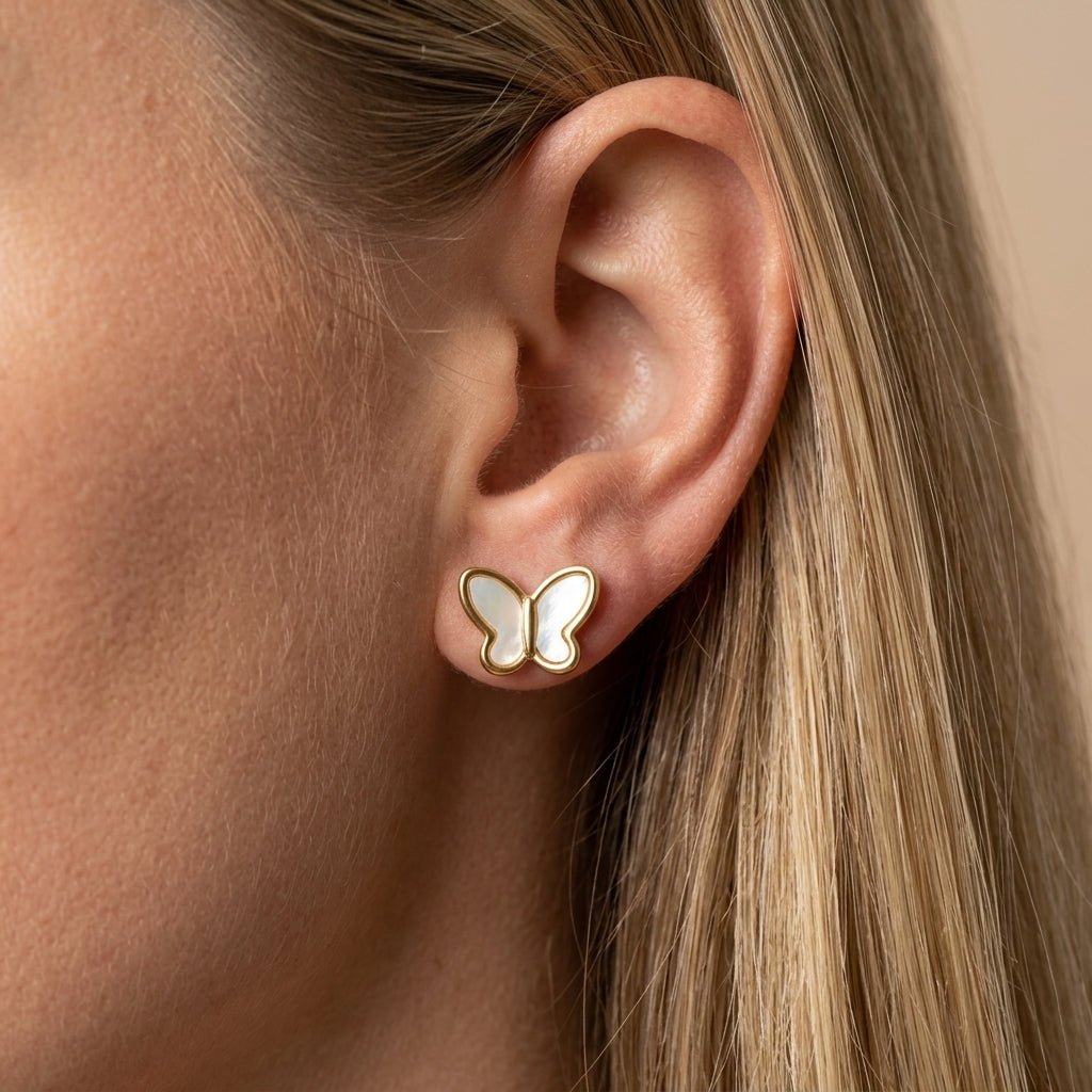 butterfly earrings gold butterfly stud earrings with white enamel details for a delicate feminine jewelry look perfect for everyday wear