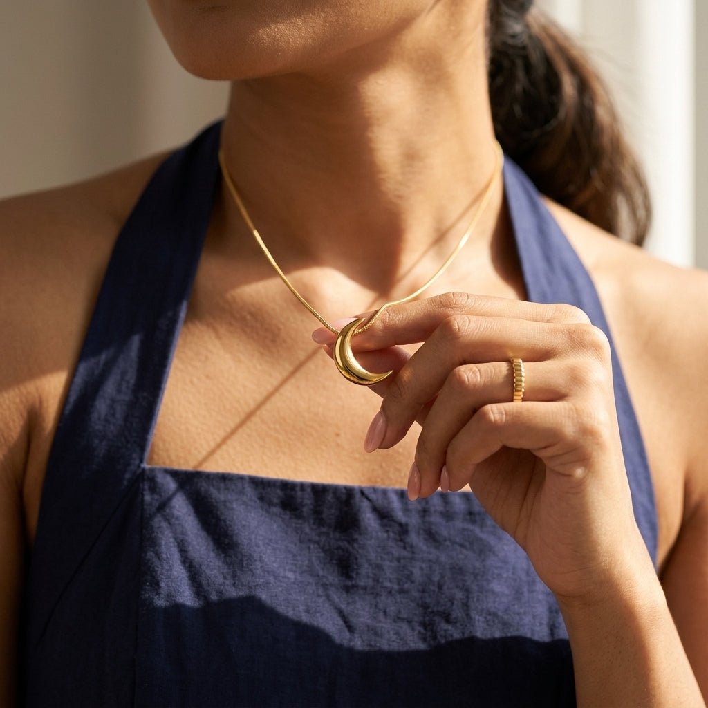 celestial crescent moon necklace with a polished gold pendant
