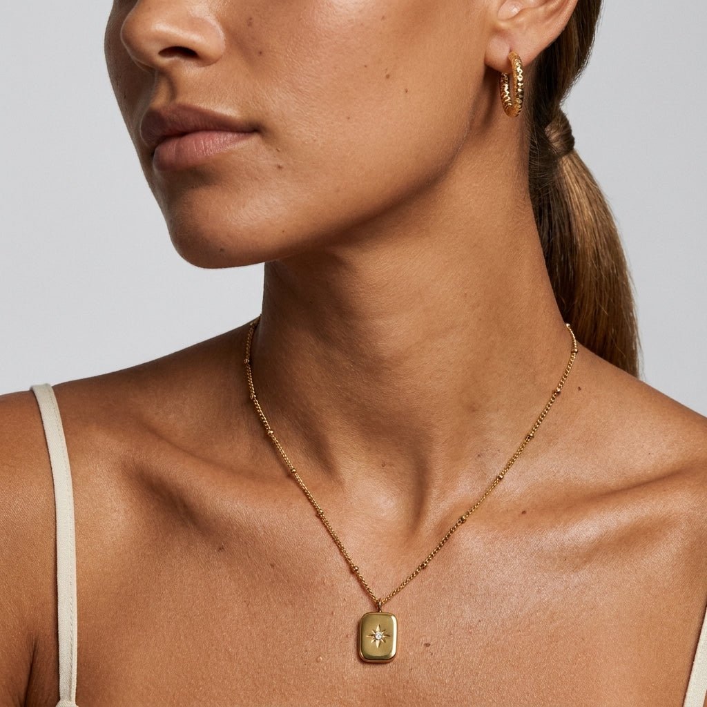 celestial gold pendant necklace featuring a delicate starburst design