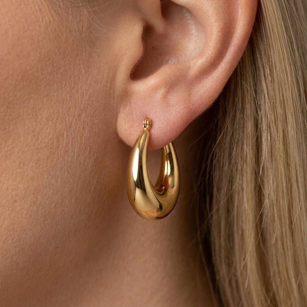 chunky gold hoop earrings with a bold polished dome design for a modern statement jewelry look in gold chunky earrings finish
