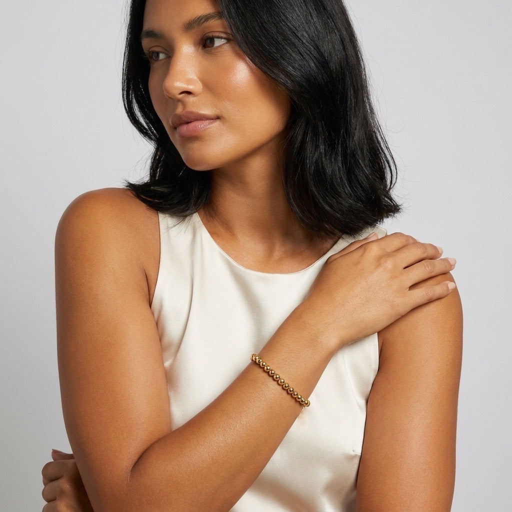 classic gold bead bracelet featuring a row of smooth rounded gold beads for timeless and versatile women's jewelry