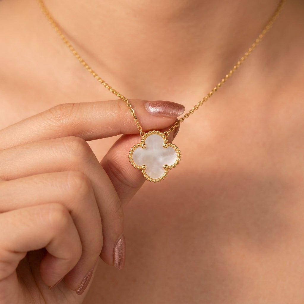 clover pendant necklace with white mother of pearl style inlay, gold beaded border and delicate chain