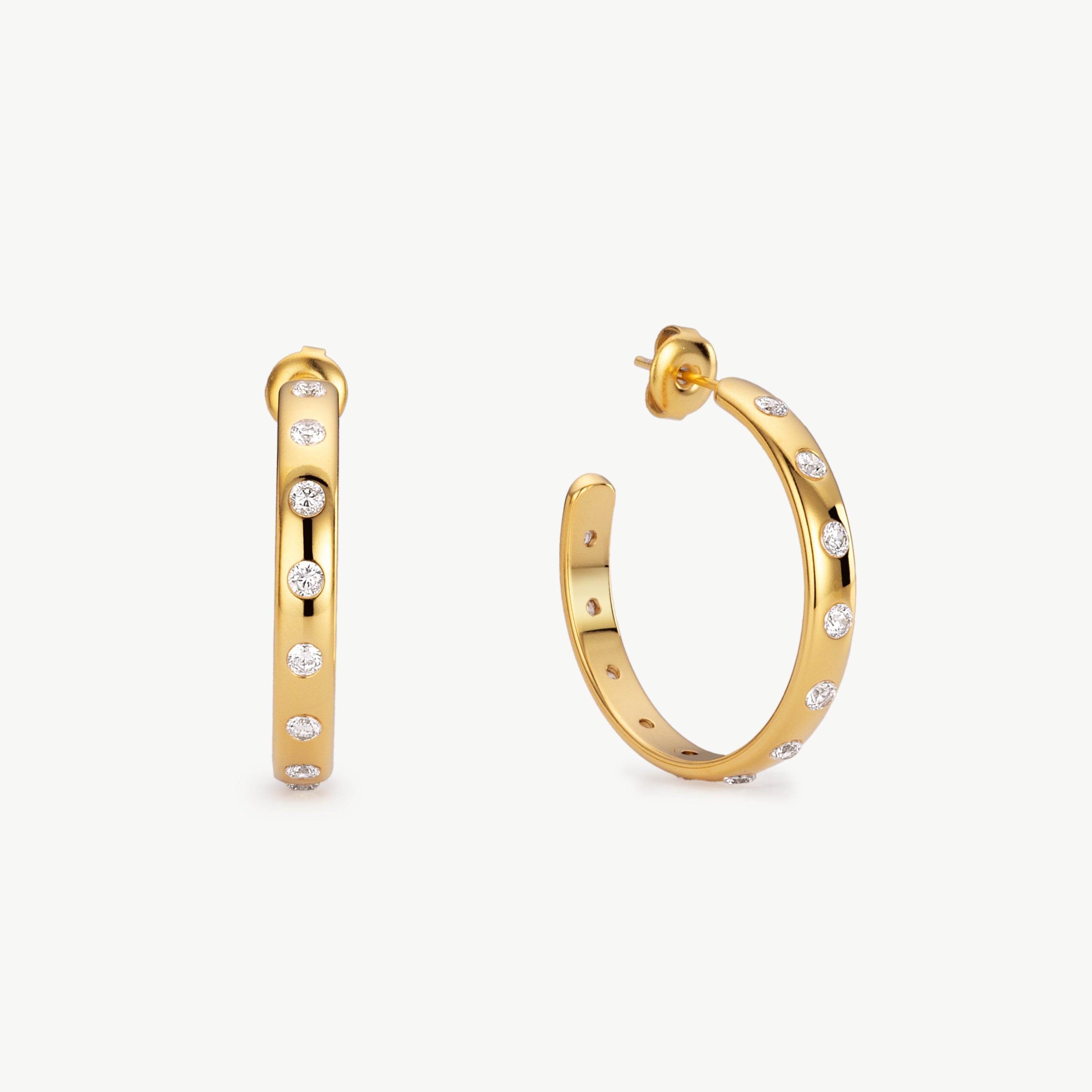 gold cubic zirconia hoops with sculpted curves, bezel-set sparkling stones, lightweight, waterproof, non-tarnish, perfect for everyday wear and layered ear styling gold half hoop earrings cz hoops gold hoops