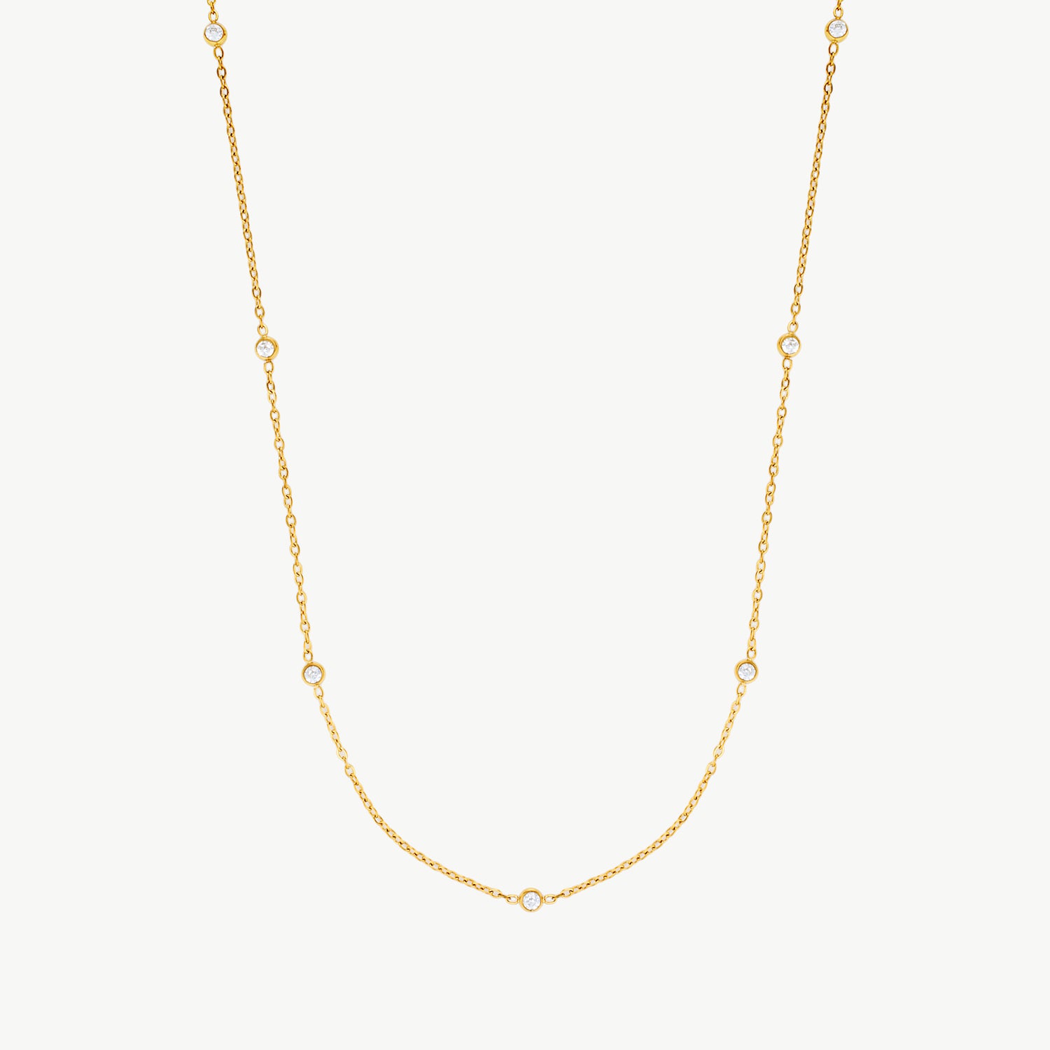 cubic zirconia station necklace with bezel-set cz stones on a waterproof gold chain