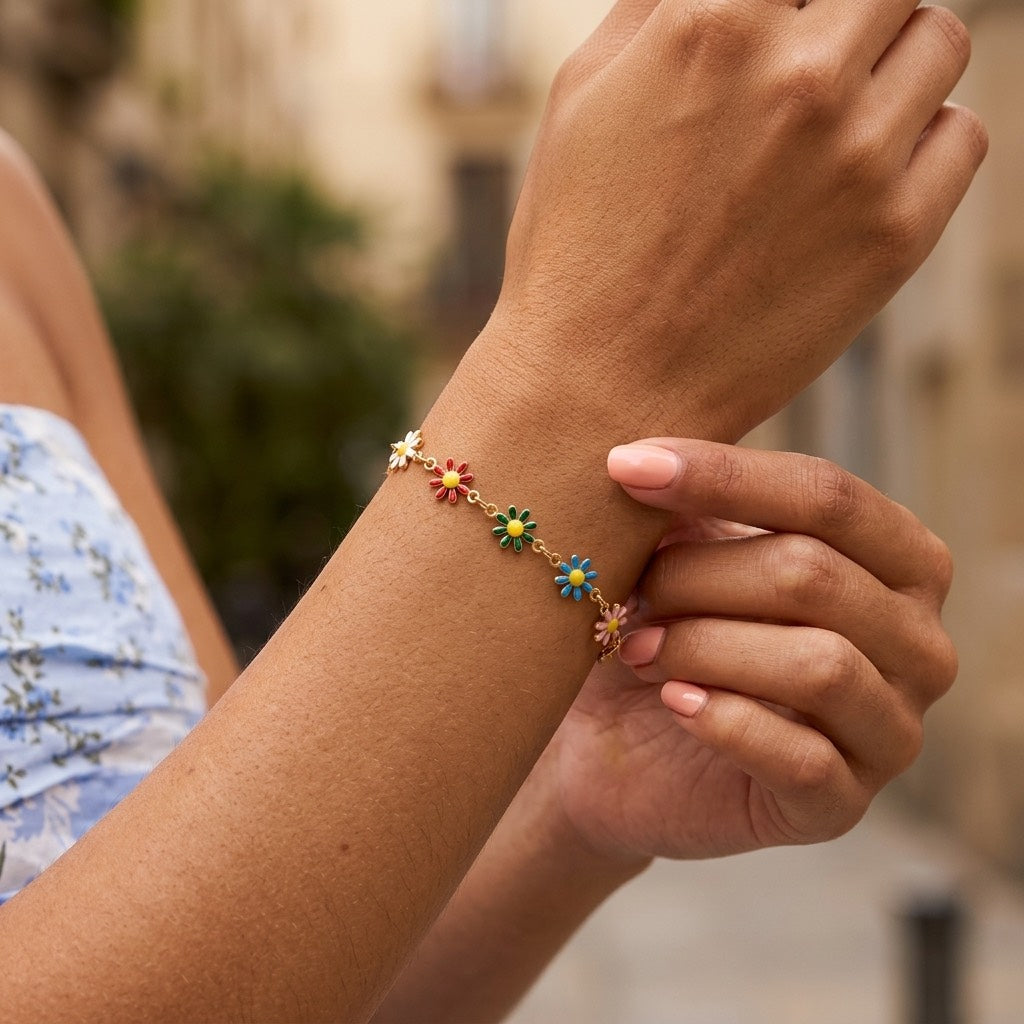cute multicolor flower bracelet for women featuring small colorful daisy charms spaced along a delicate gold chain for playful and stylish everyday jewelry