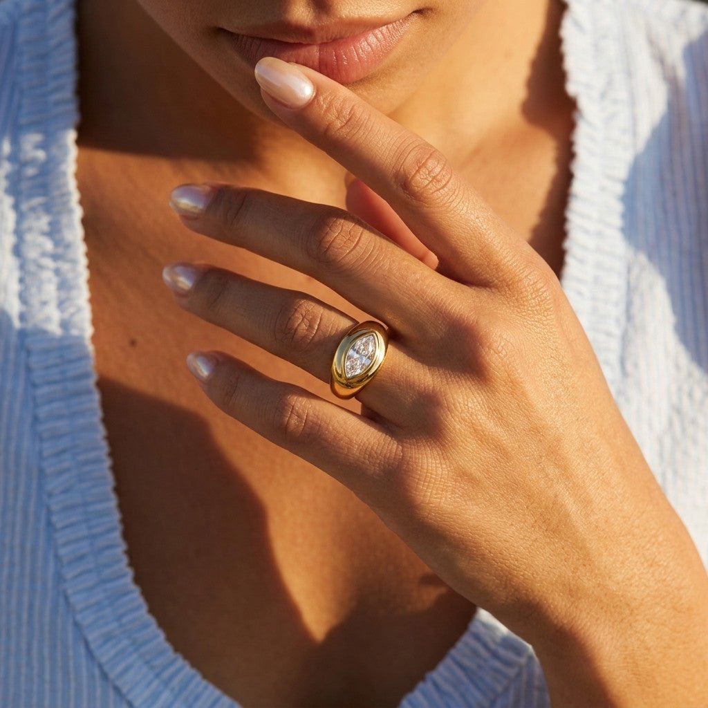 cz stone gold ring with sparkling clear stones in a marquise shaped statement setting