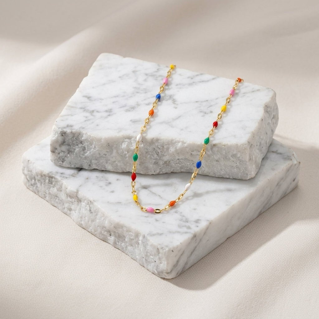 dainty rainbow bead necklace with a delicate gold chain