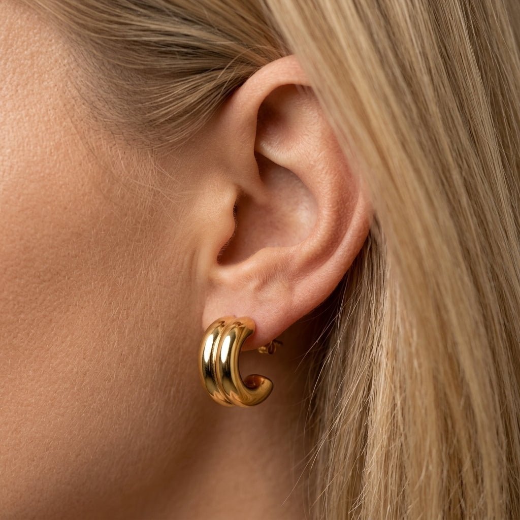 double gold hoop earrings sculpted double-layer gold hoop earrings with a chunky curved silhouette and mirror-shine finish, inspired by bold contemporary styling with a sleek elevated edge for statement everyday waterproof earrings