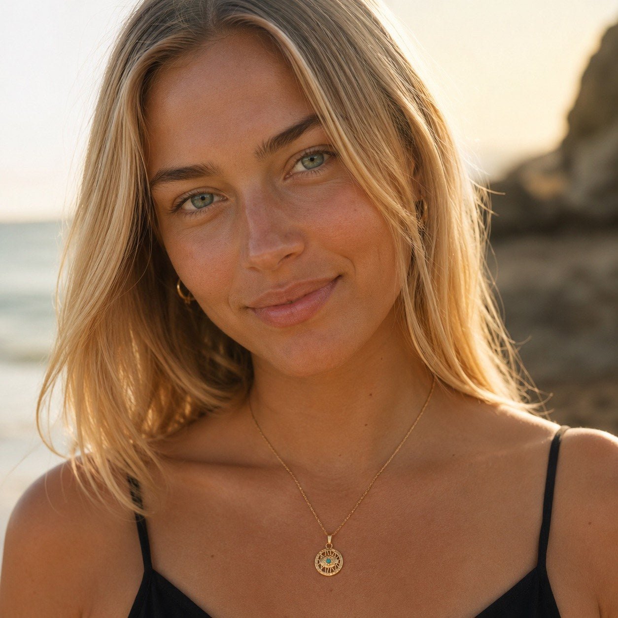 evil eye necklace for women featuring a gold medallion pendant with turquoise center detail
