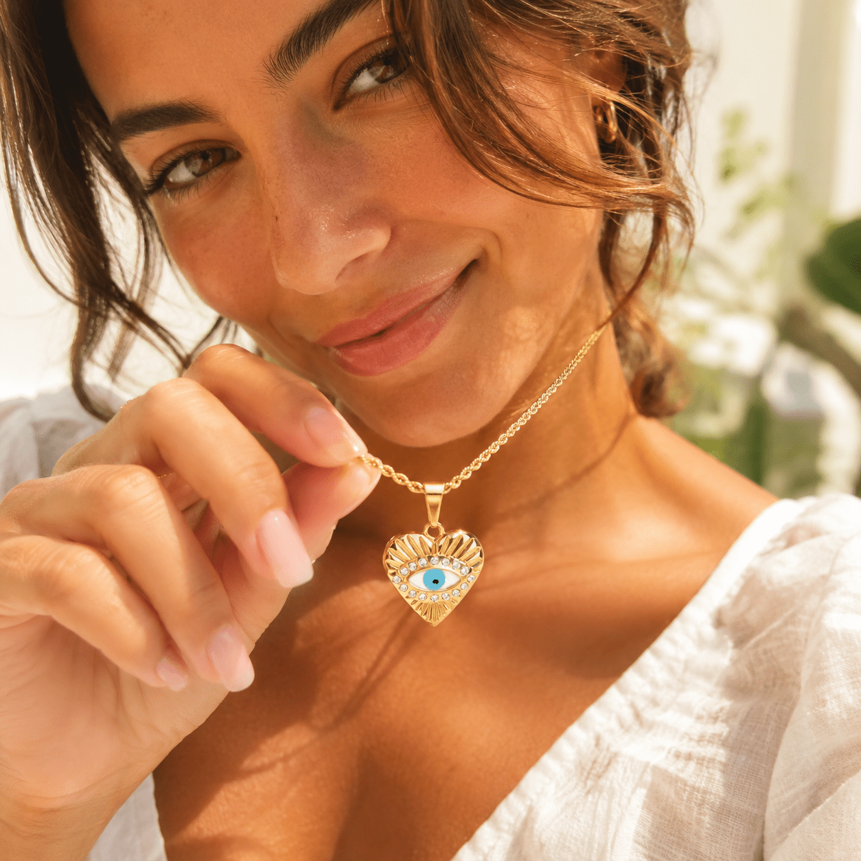 evil eye protection necklace with heart charm and sparkling crystal accents