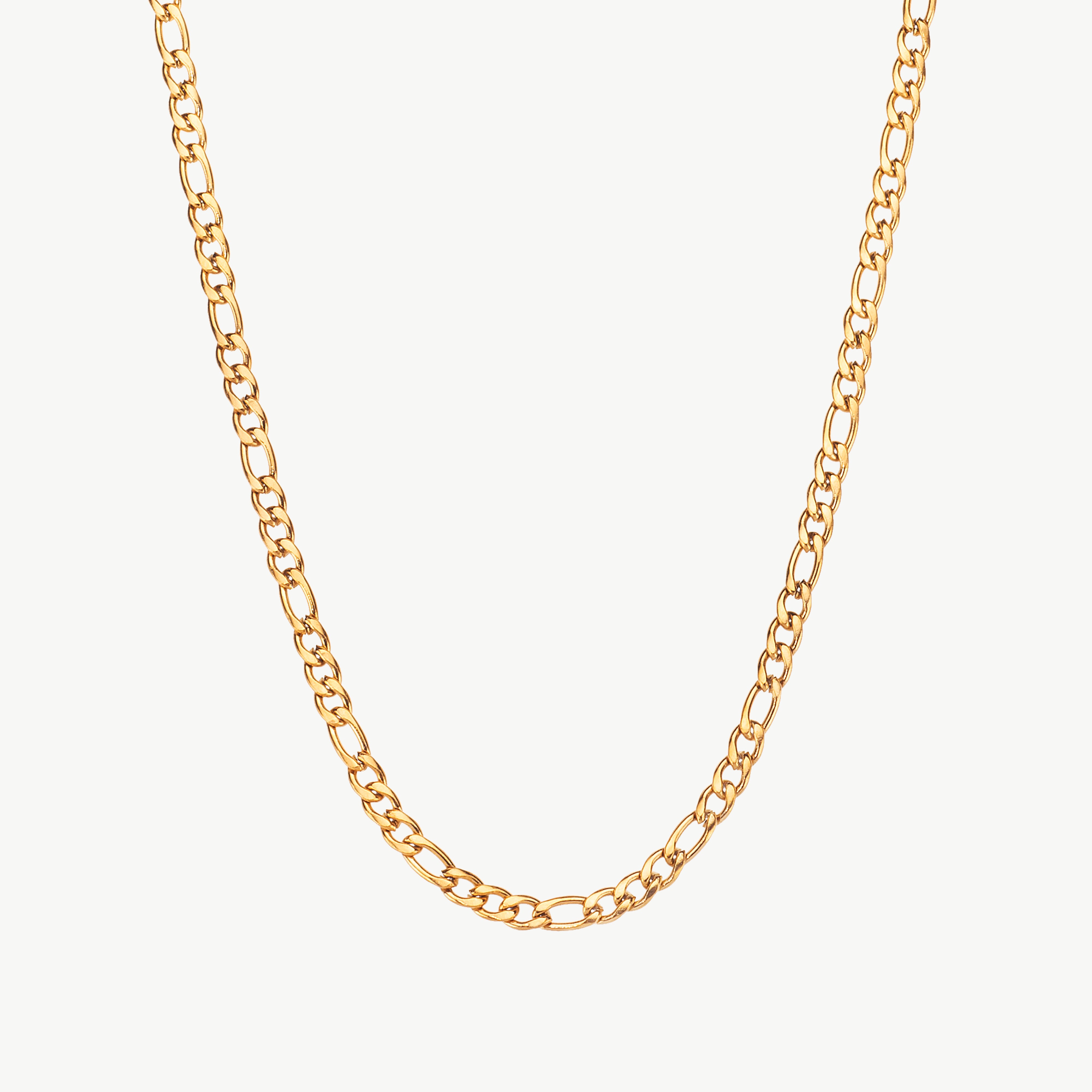 figaro chain necklace in gold with alternating links, gold figaro chain necklace styled as a womens gold chain necklace resting along the neckline