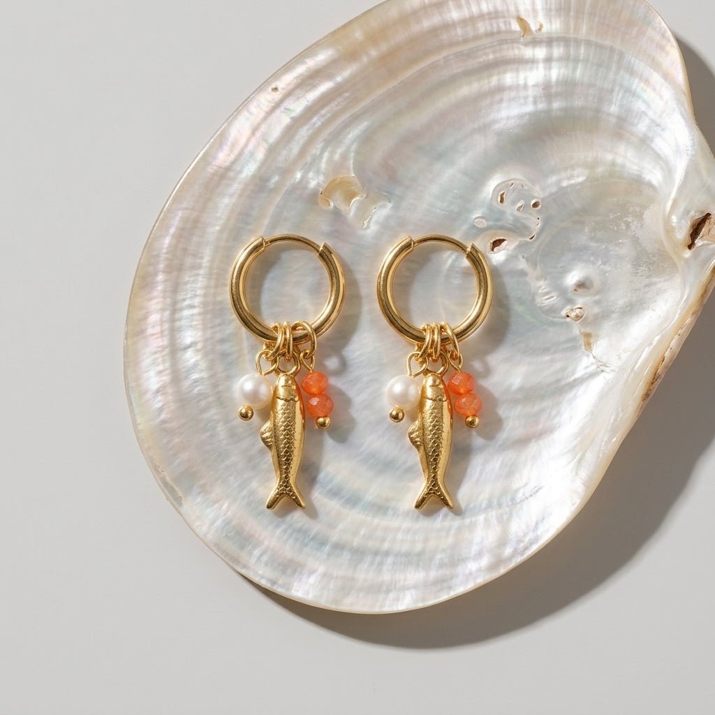 fish charm earrings playful gold fish hoop earrings with pearl and coral bead charms coastal jewelry beach earrings style