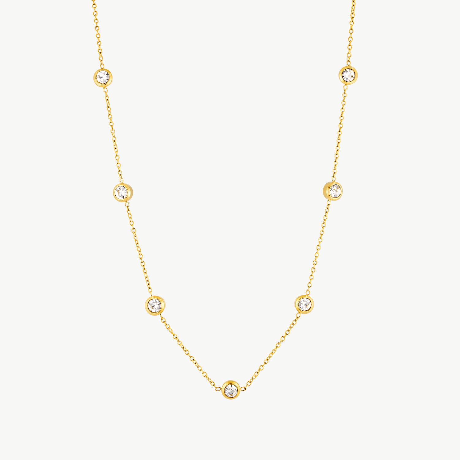 gemstone station necklace with bezel-set cubic zirconia stones on a waterproof gold chain for everyday wear