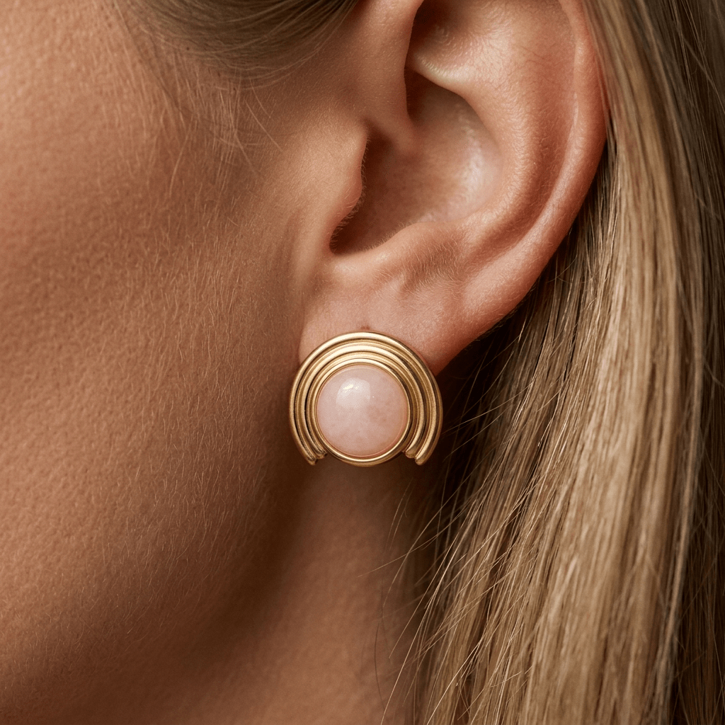 gold and pink stud earrings with a round pink center stone