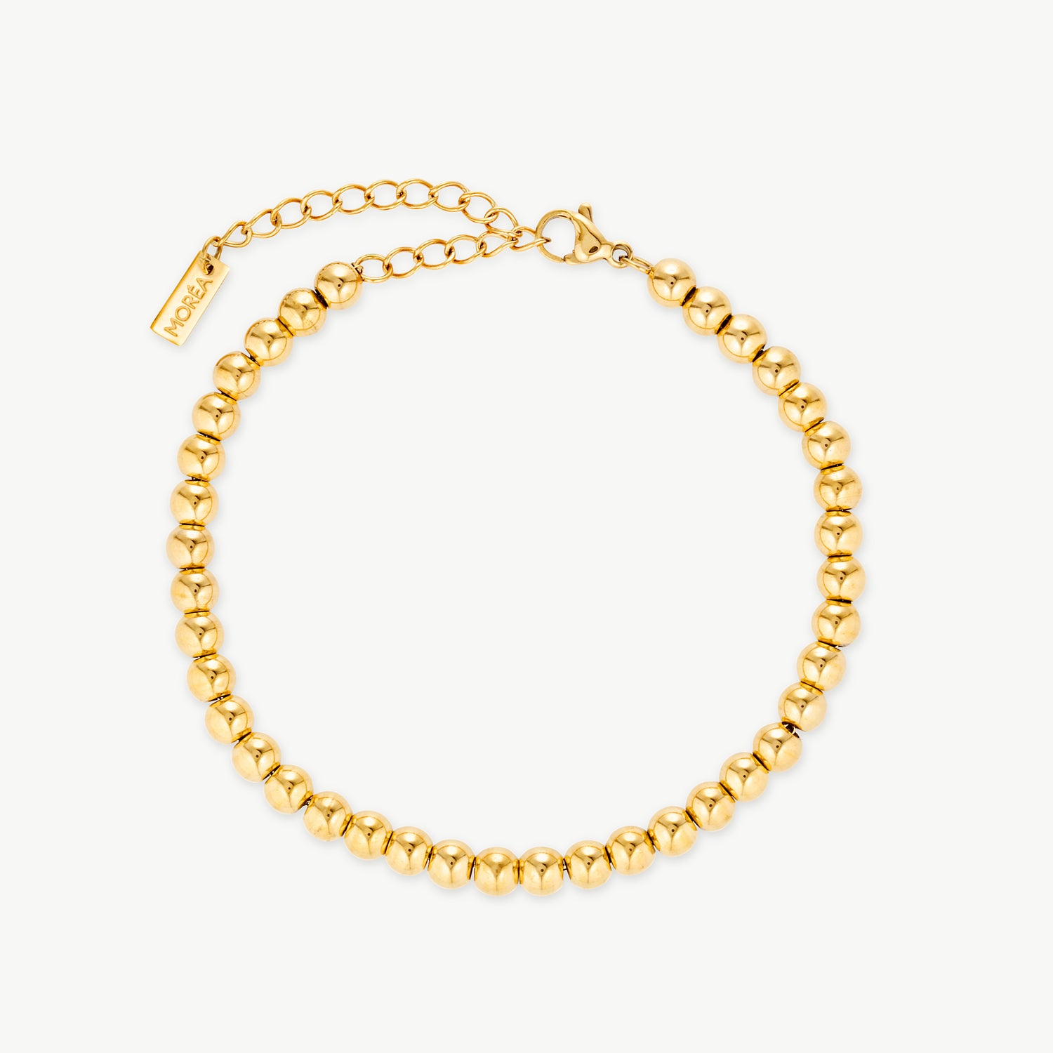 gold ball bracelet featuring a continuous row of smooth polished gold beads