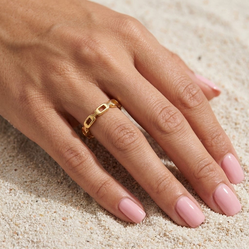 gold chain band with interconnected open links and a sleek polished design
