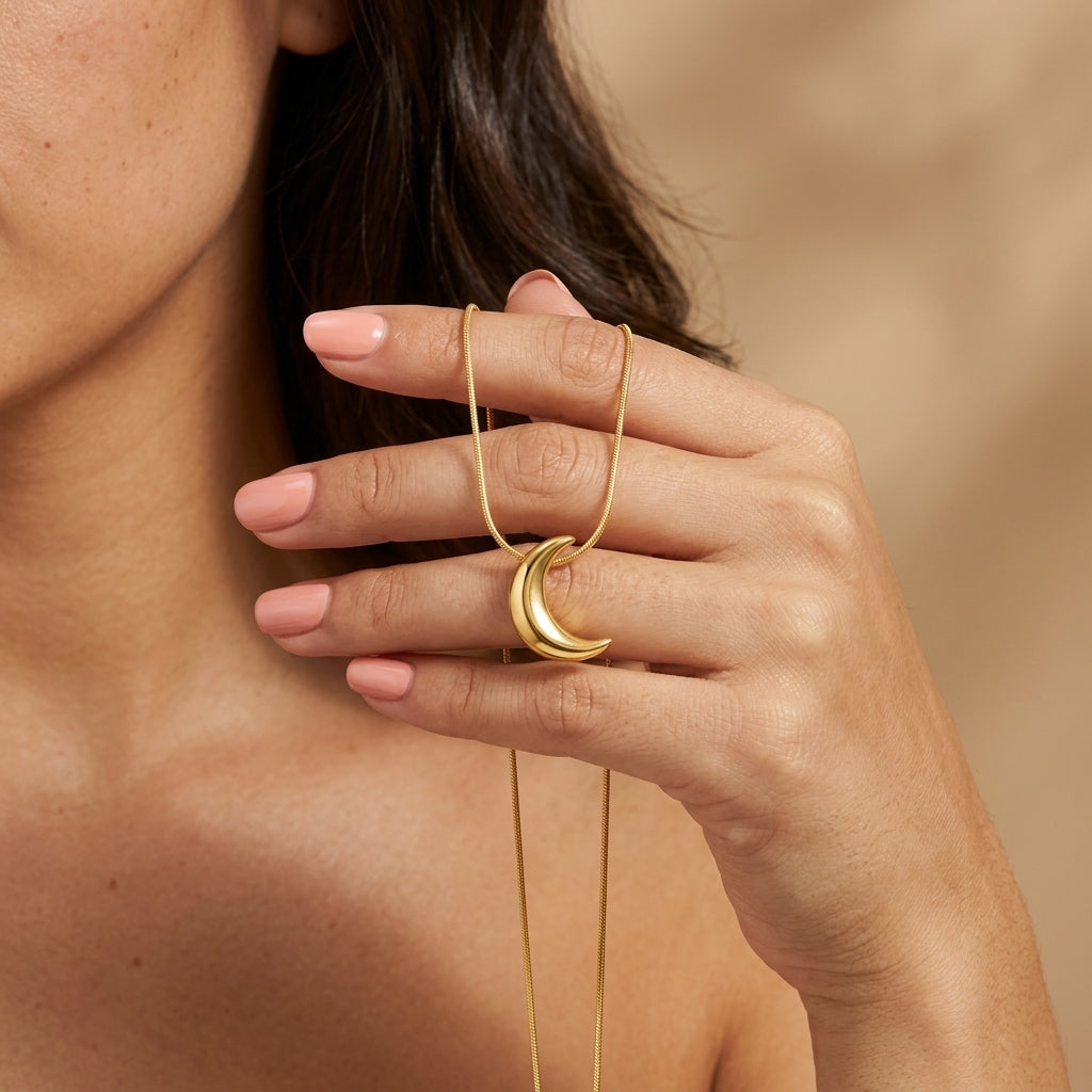 gold crescent moon necklace with a curved moon pendant