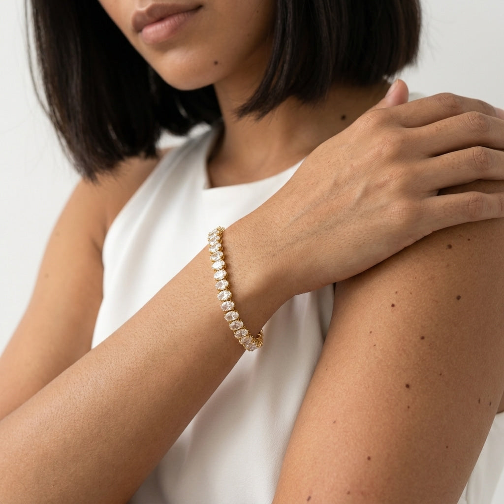gold crystal tennis bracelet for women featuring brilliant clear marquise crystals in elegant gold settings for a luxurious and feminine jewelry look