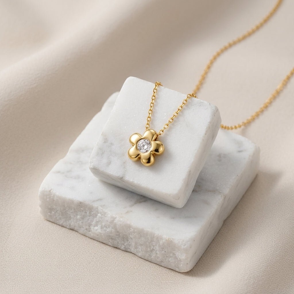 gold floral necklace with a sparkling cubic zirconia flower pendant
