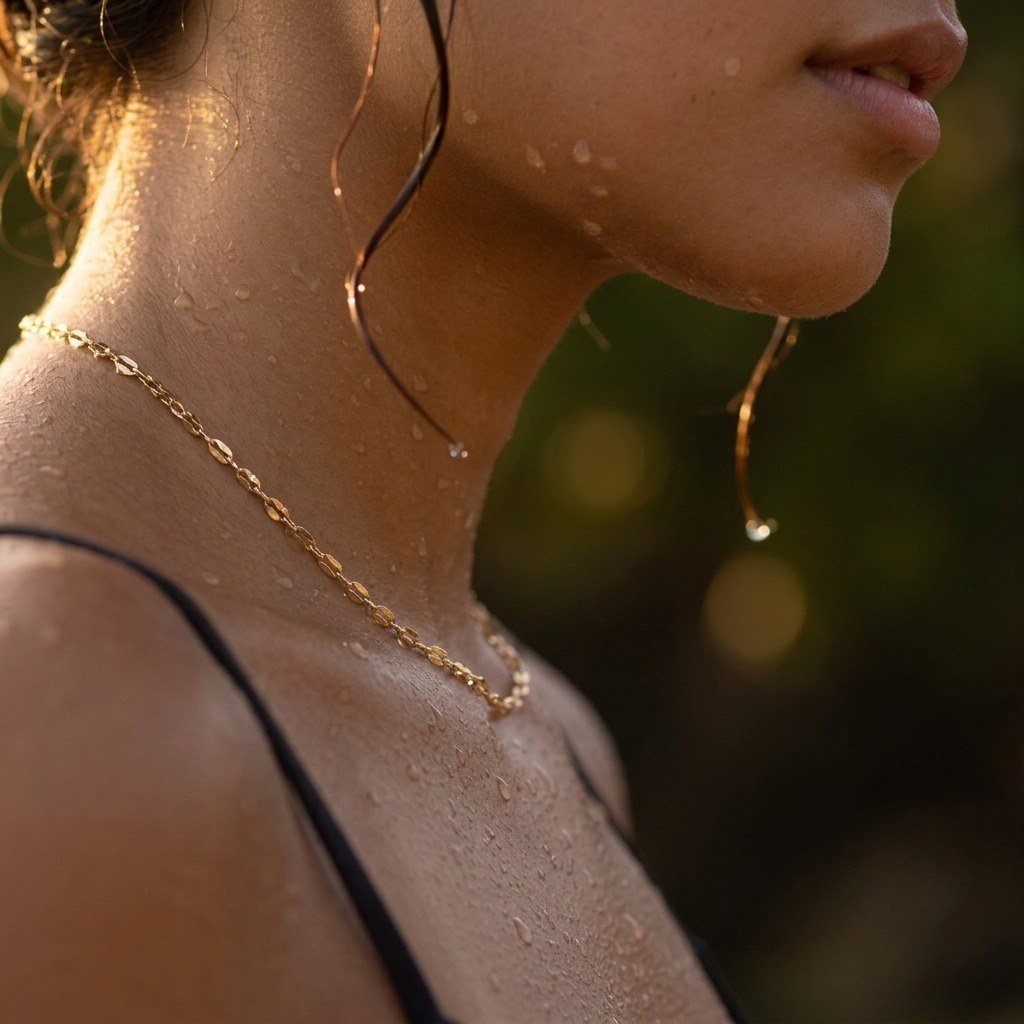 gold lip chain necklace featuring delicate reflective links with a sleek polished finish