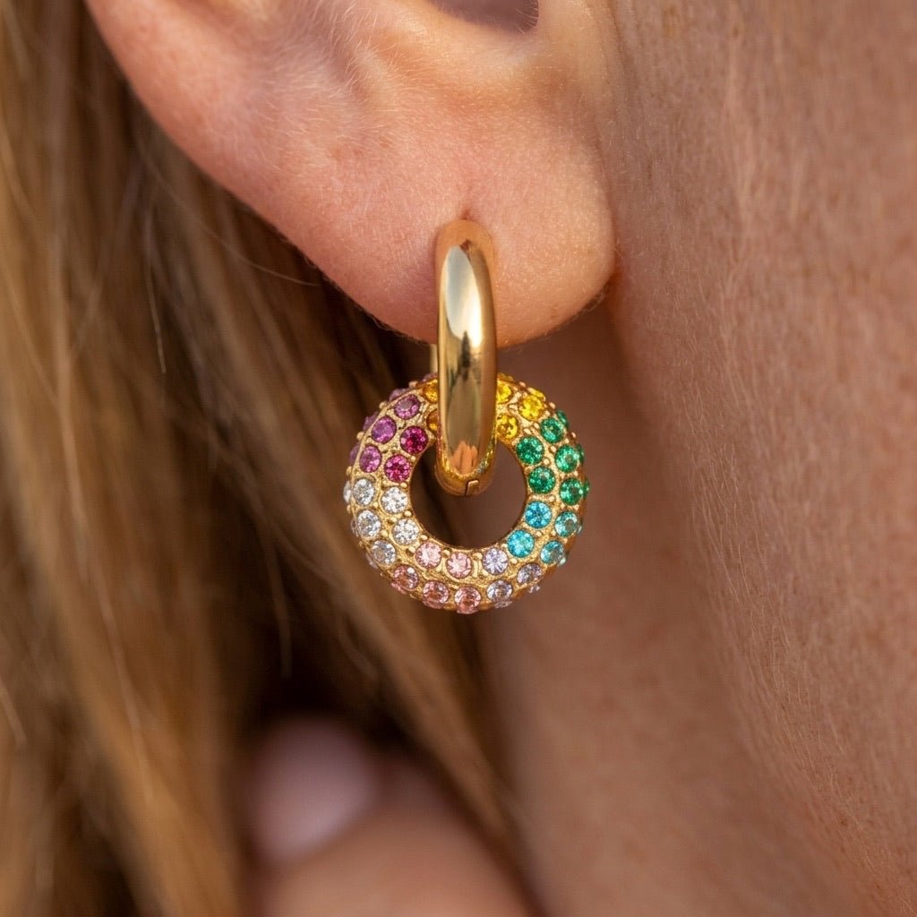 gold rainbow hoops featuring colorful sparkling crystal accents