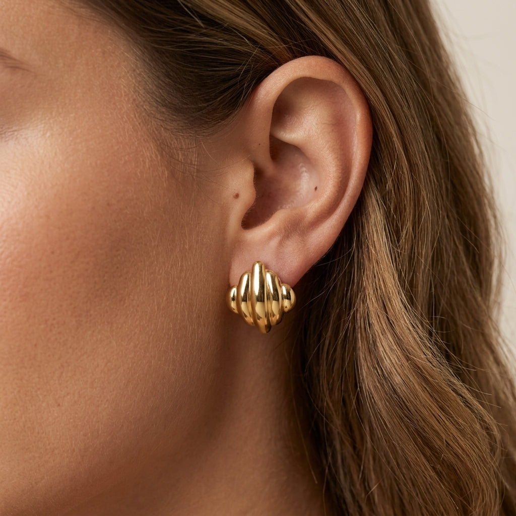 gold square stud earrings with rounded sculptural detailing