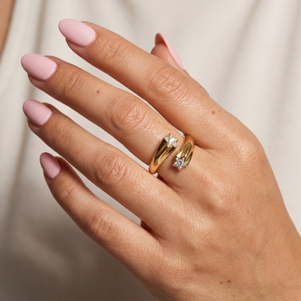 gold star ring with sparkling pavé star details and a bold polished open band, worn on hand