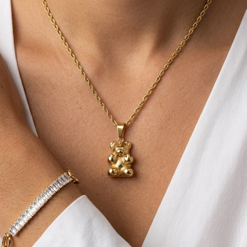 gold teddy bear necklace for women featuring a cute teddy bear charm pendant on a delicate gold chain for playful everyday jewelry styling