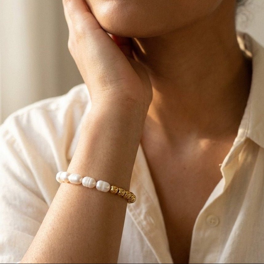 half pearl half gold bracelet combining white pearls with polished gold beads for a modern statement look