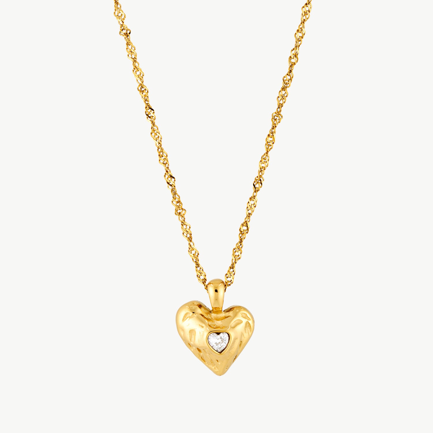 heart crystal necklace gold puffy heart pendant with heart shaped cubic zirconia stone on a delicate textured chain