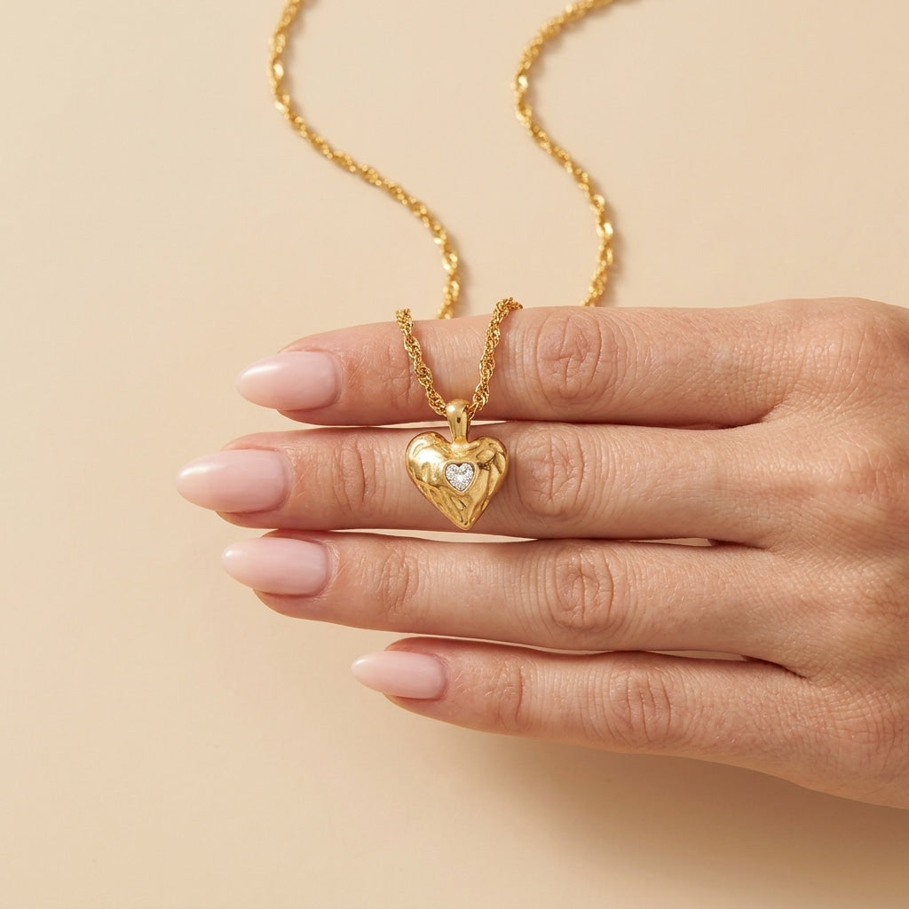 heart necklace gift for her featuring a gold heart pendant with a sparkling clear crystal accent and delicate twisted chain for a romantic jewelry look
