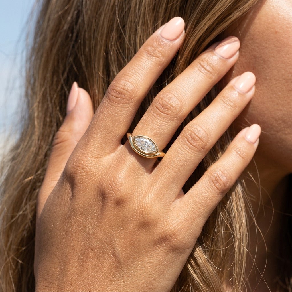 marquise cut style ring with sparkling cz stones and a refined gold setting