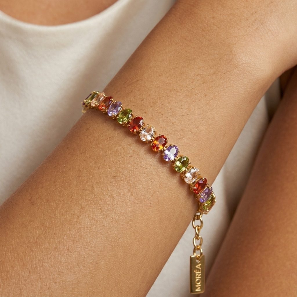 multicolor cubic zirconia tennis bracelet with oval-cut colorful CZ stones in a polished gold-tone setting