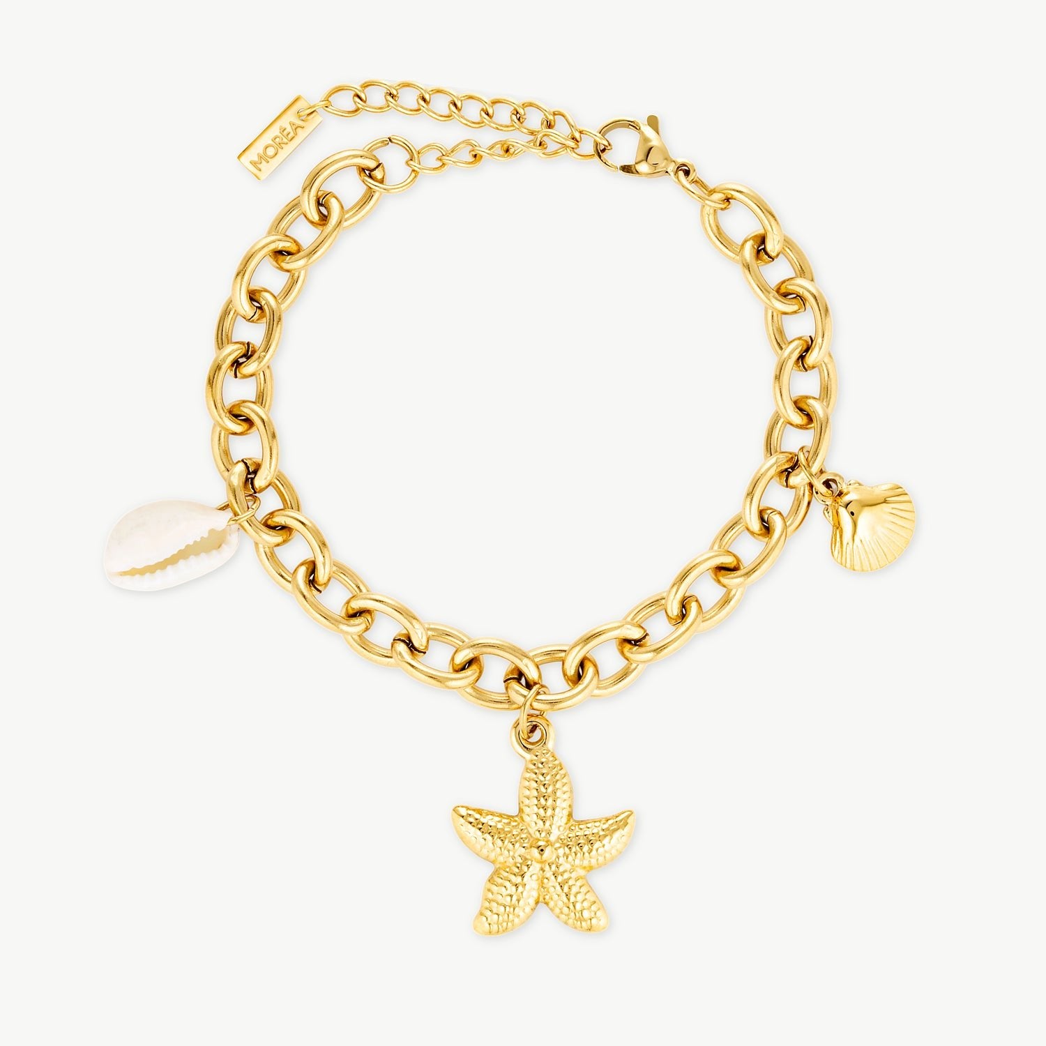 ocean charm bracelet with gold starfish charm shell detailing and chunky gold chain inspired by luxury beach jewelry