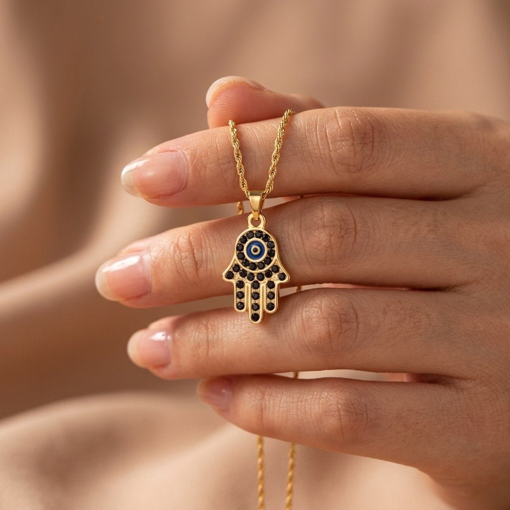 protective eye hand necklace with a symbolic hamsa pendant and blue evil eye detail