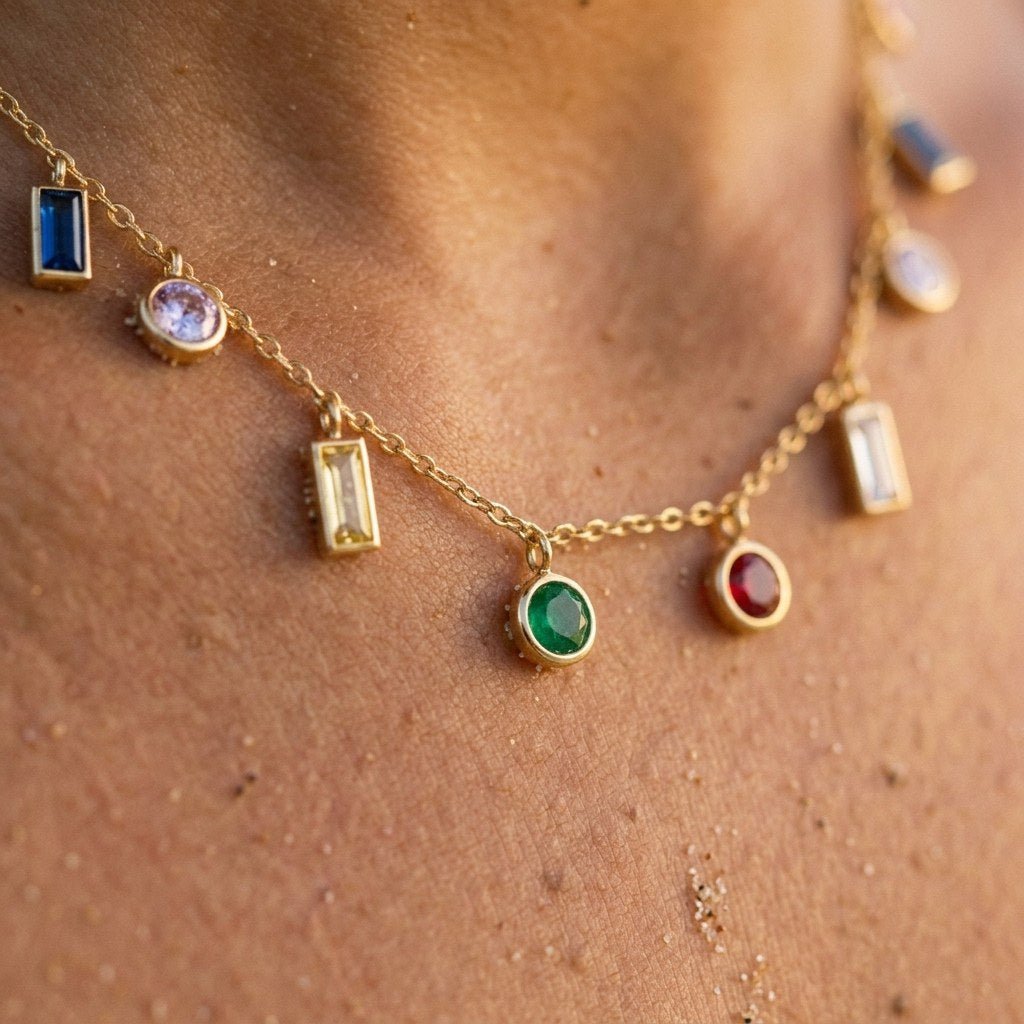 rainbow gemstone gold necklace featuring mixed colourful stone charms on a fine chain
