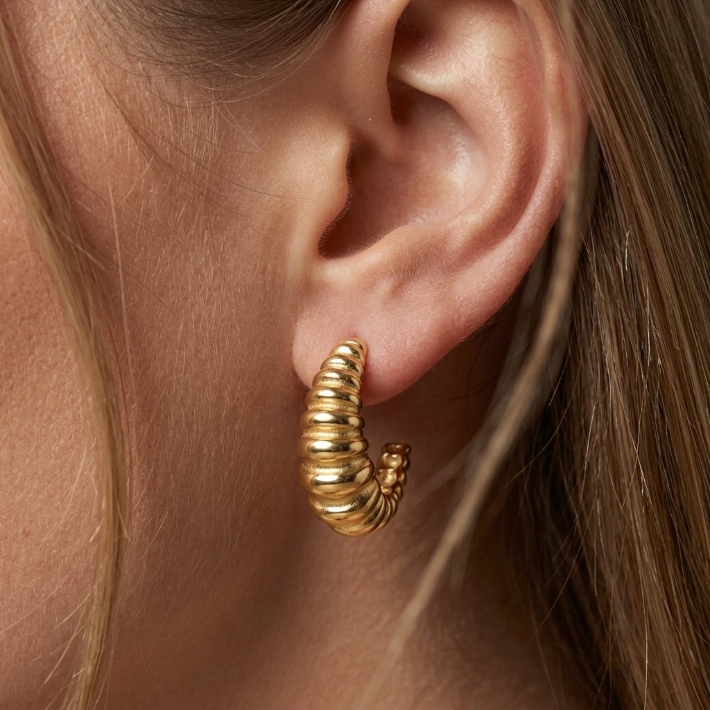 ribbed earrings chunky gold ribbed hoop earrings with a sculpted layered design and polished finish, creating a bold contemporary statement with vintage-inspired texture and effortless modern elegance