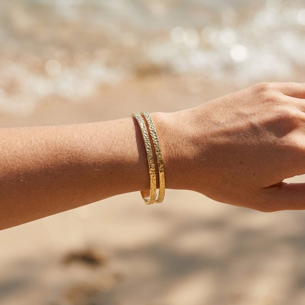 stacked gold hammered bangle bracelets for women featuring a handcrafted textured look
