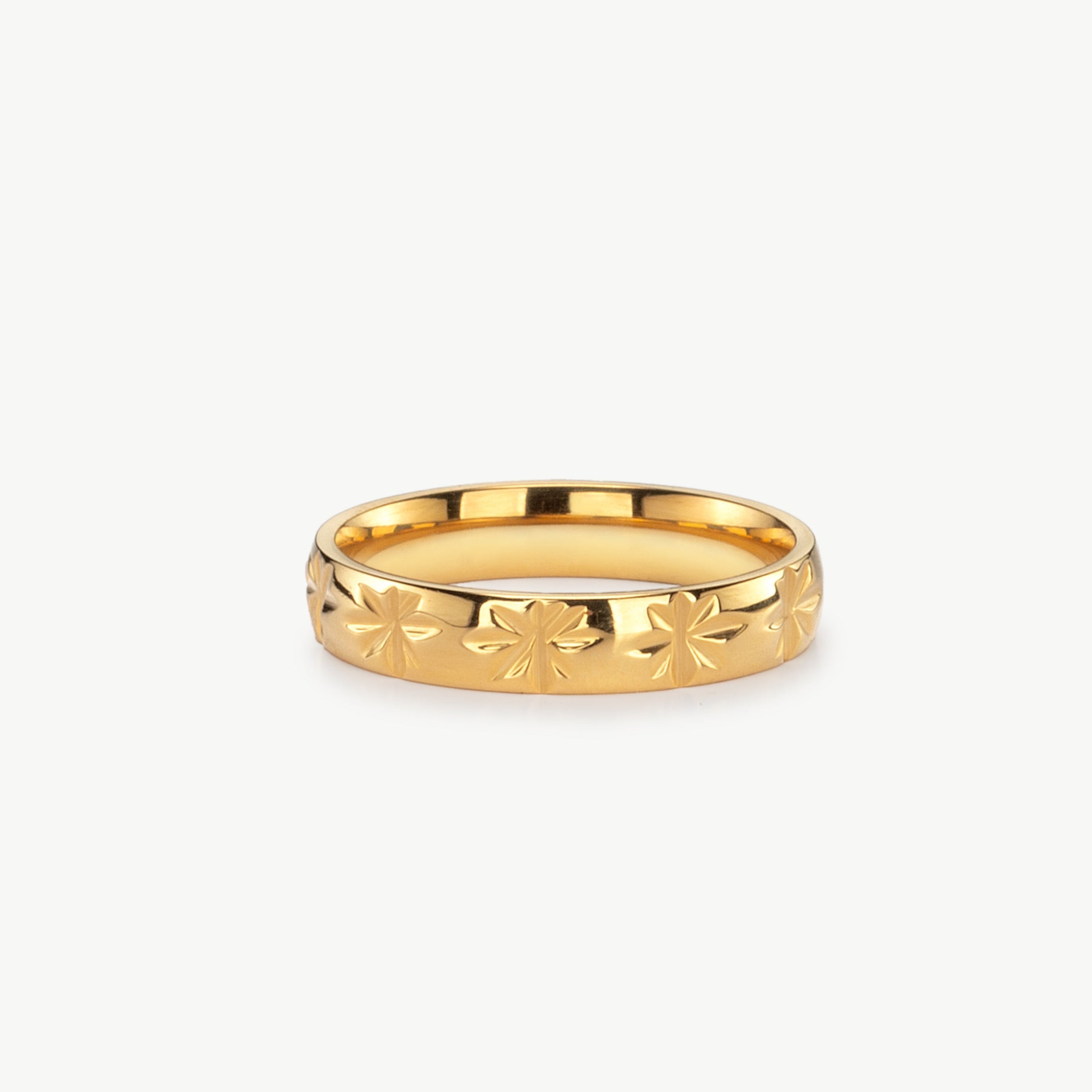 star band ring in gold with engraved star ring detail, gold star band ring with smooth polished finish and minimalist celestial ring