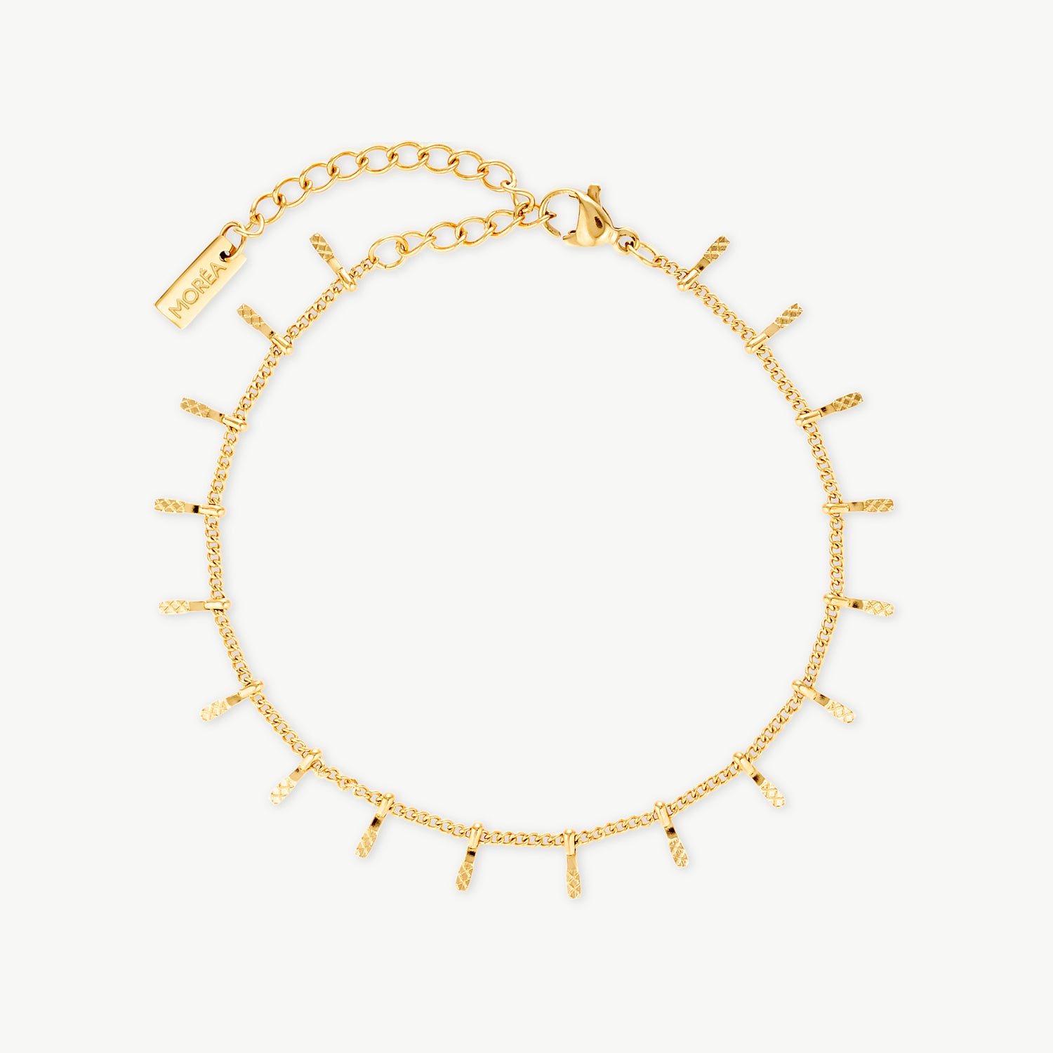 sun bracelet with textured dangling gold charms on a delicate fine chain bracelet designed for layered everyday jewelry styling