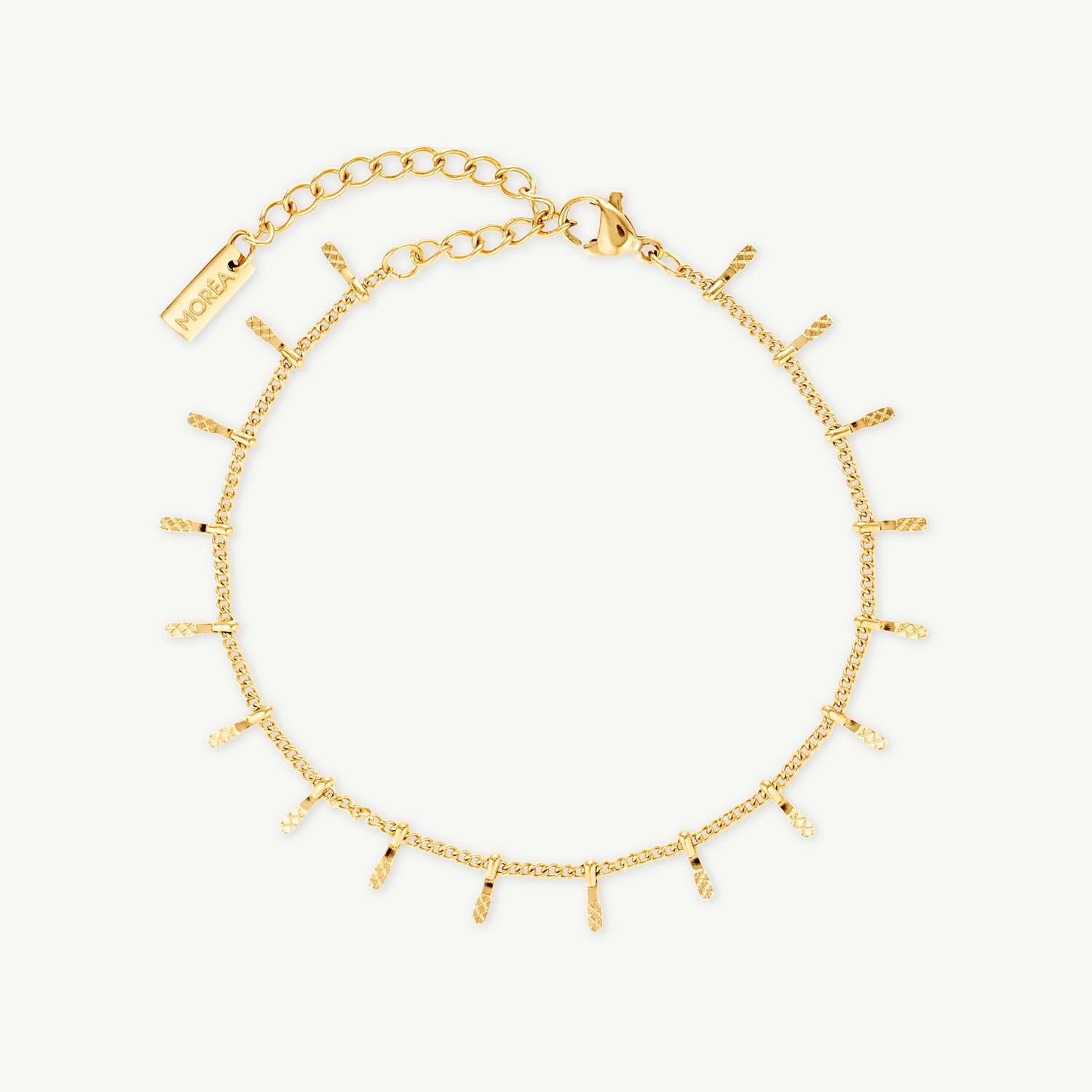 sun bracelet with textured dangling gold charms on a delicate fine chain bracelet designed for layered everyday jewelry styling