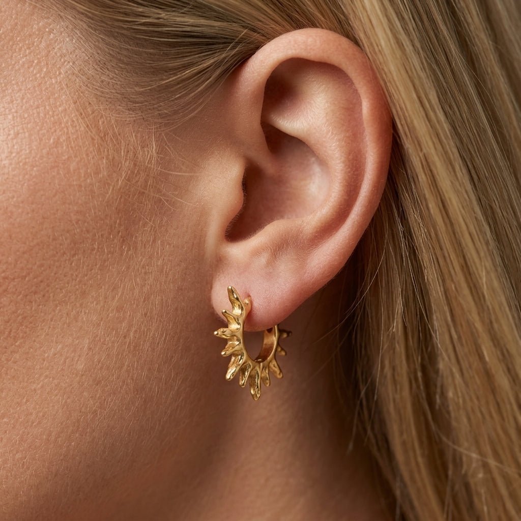 sun hoop earrings gold sunburst hoop earrings with radiant textured details for a celestial inspired statement jewelry look