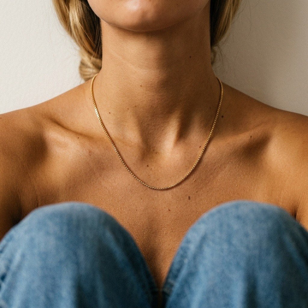 thin gold Venetian necklace featuring closely connected square links and a clean design
