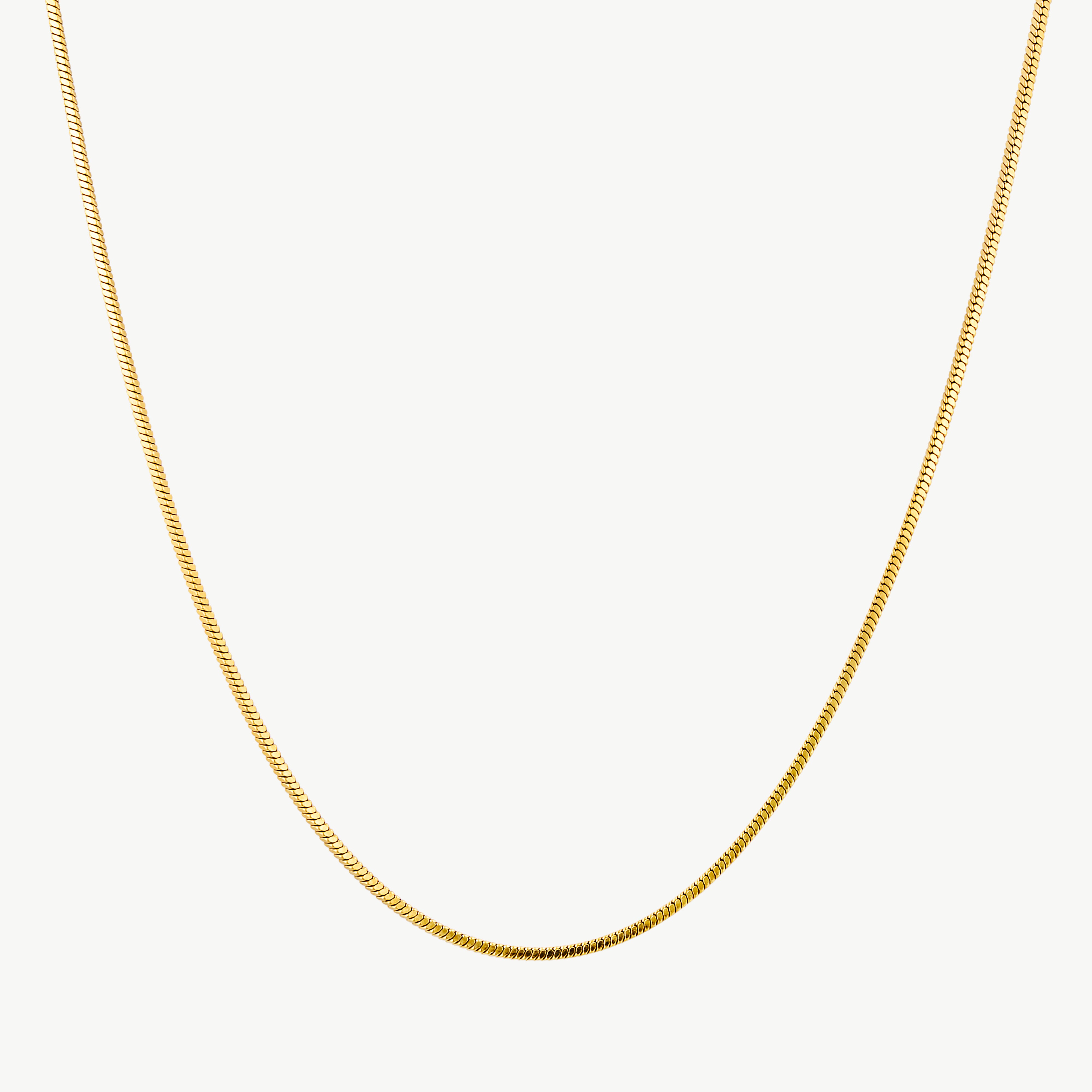 thin herringbone necklace with sleek flat gold chain and smooth reflective finish designed to sit elegantly along the neckline