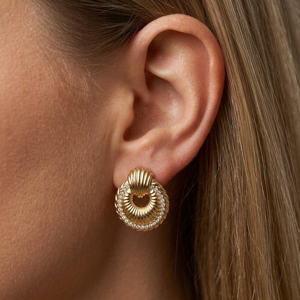 vintage stud earrings ornate gold statement studs with textured swirl detailing and delicate crystal accents