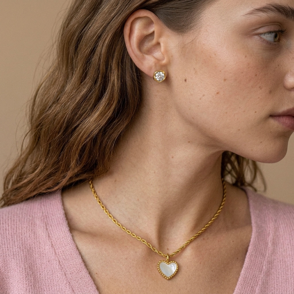 white heart pendant necklace featuring a gold beaded setting and twisted rope chain for a feminine and timeless jewelry style