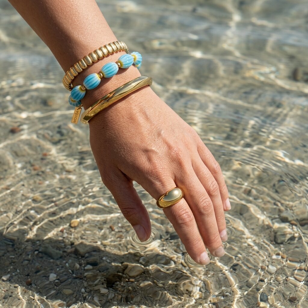 woman swimming wearing waterproof gold jewelry