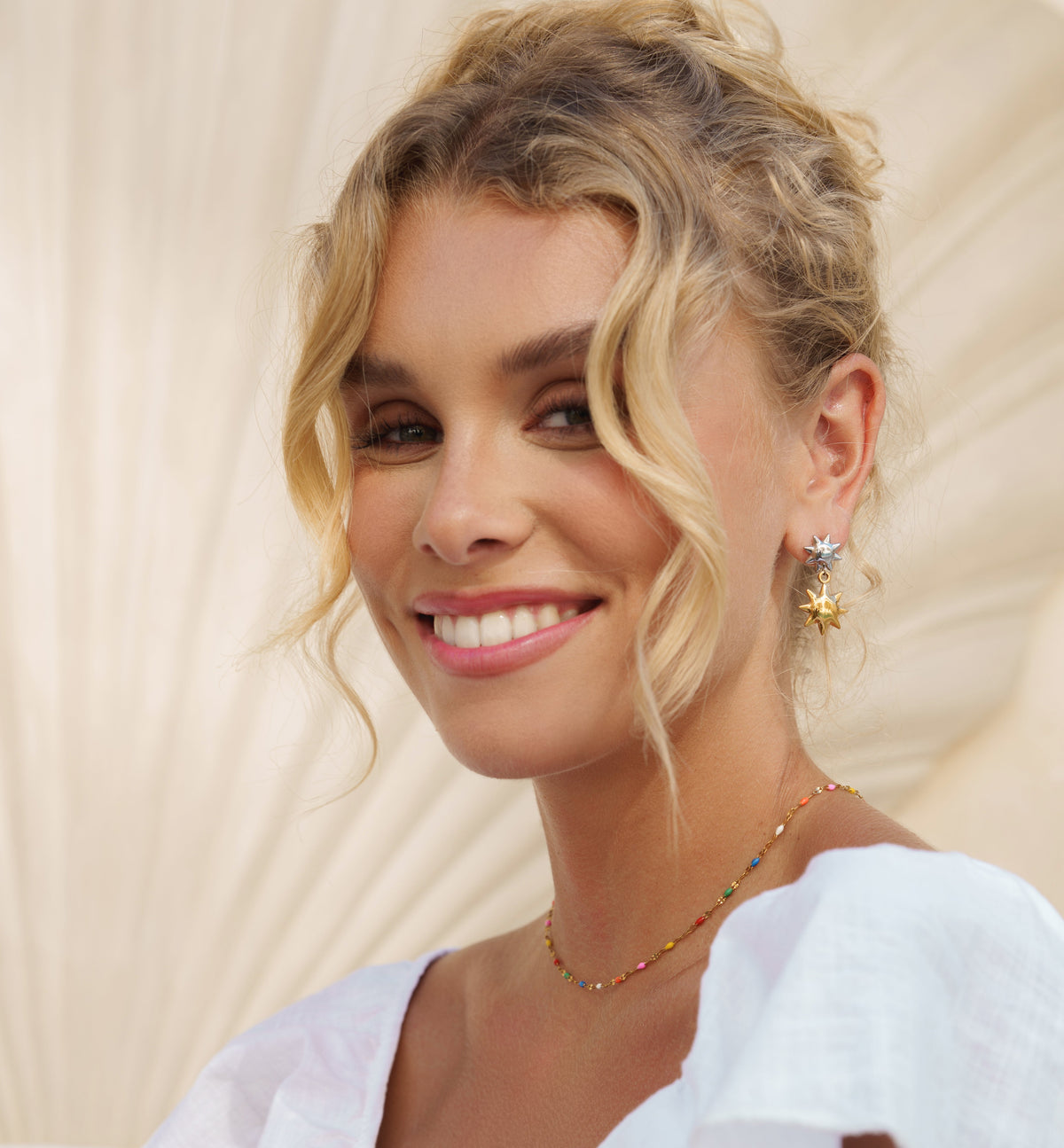 celestial jewelry collection featuring waterproof sun, moon and star inspired jewelry